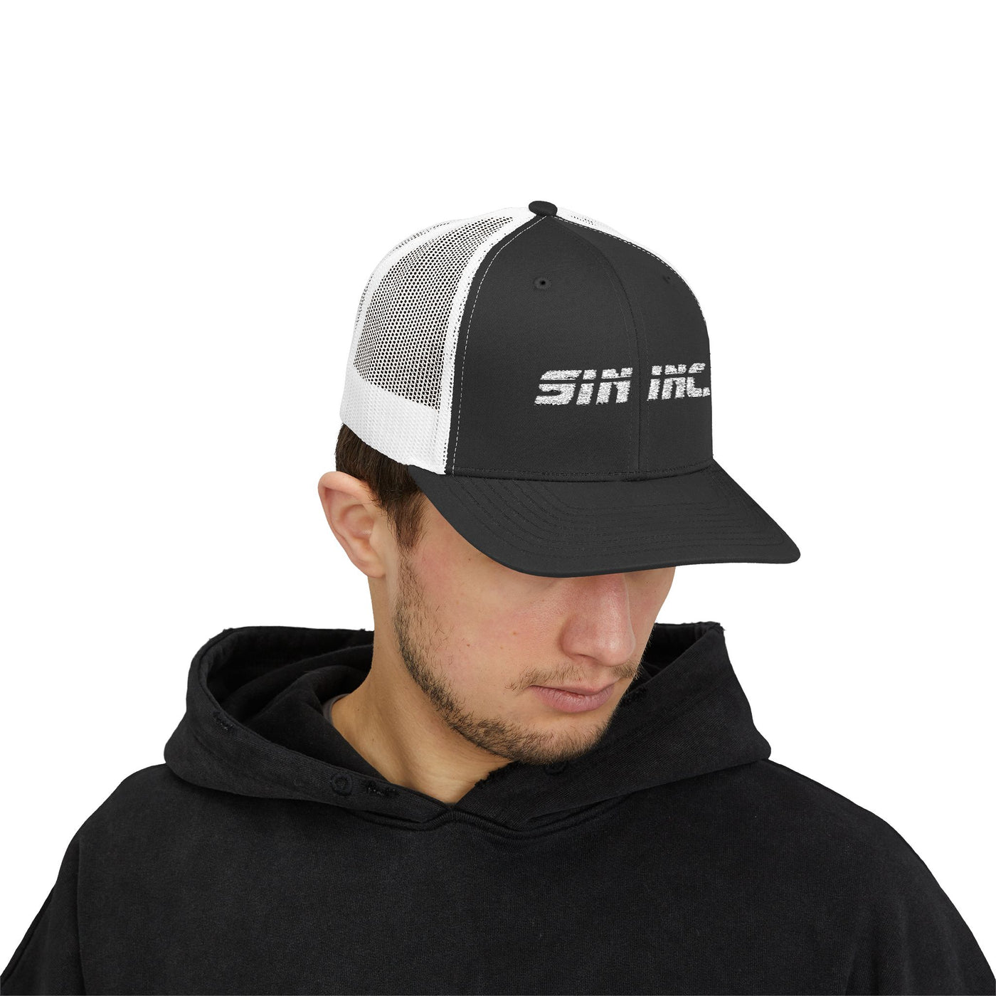 Man wearing a black and white cap with 'Sin Inc' logo on a white background
